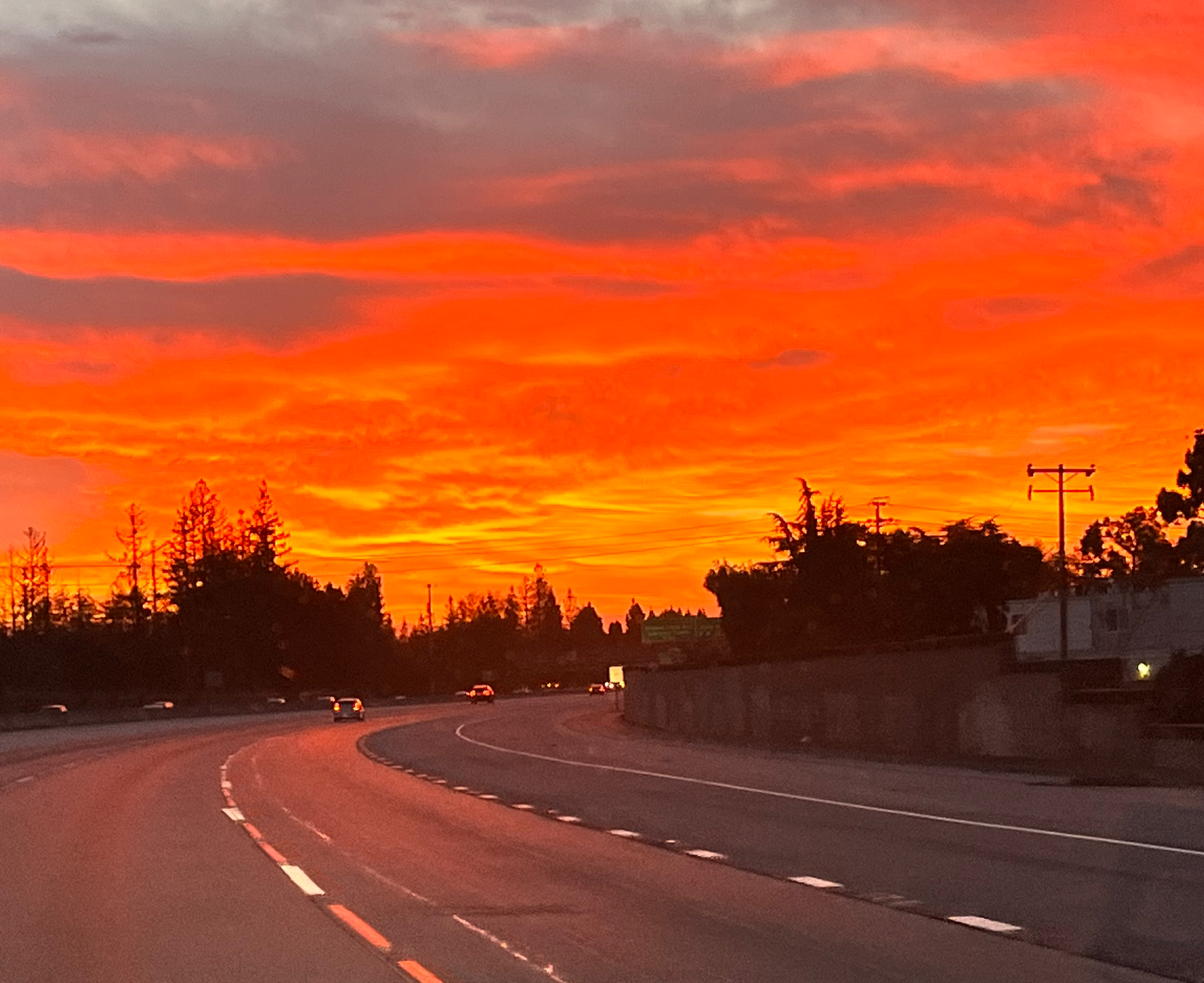 Blazing orange sunset over freeway