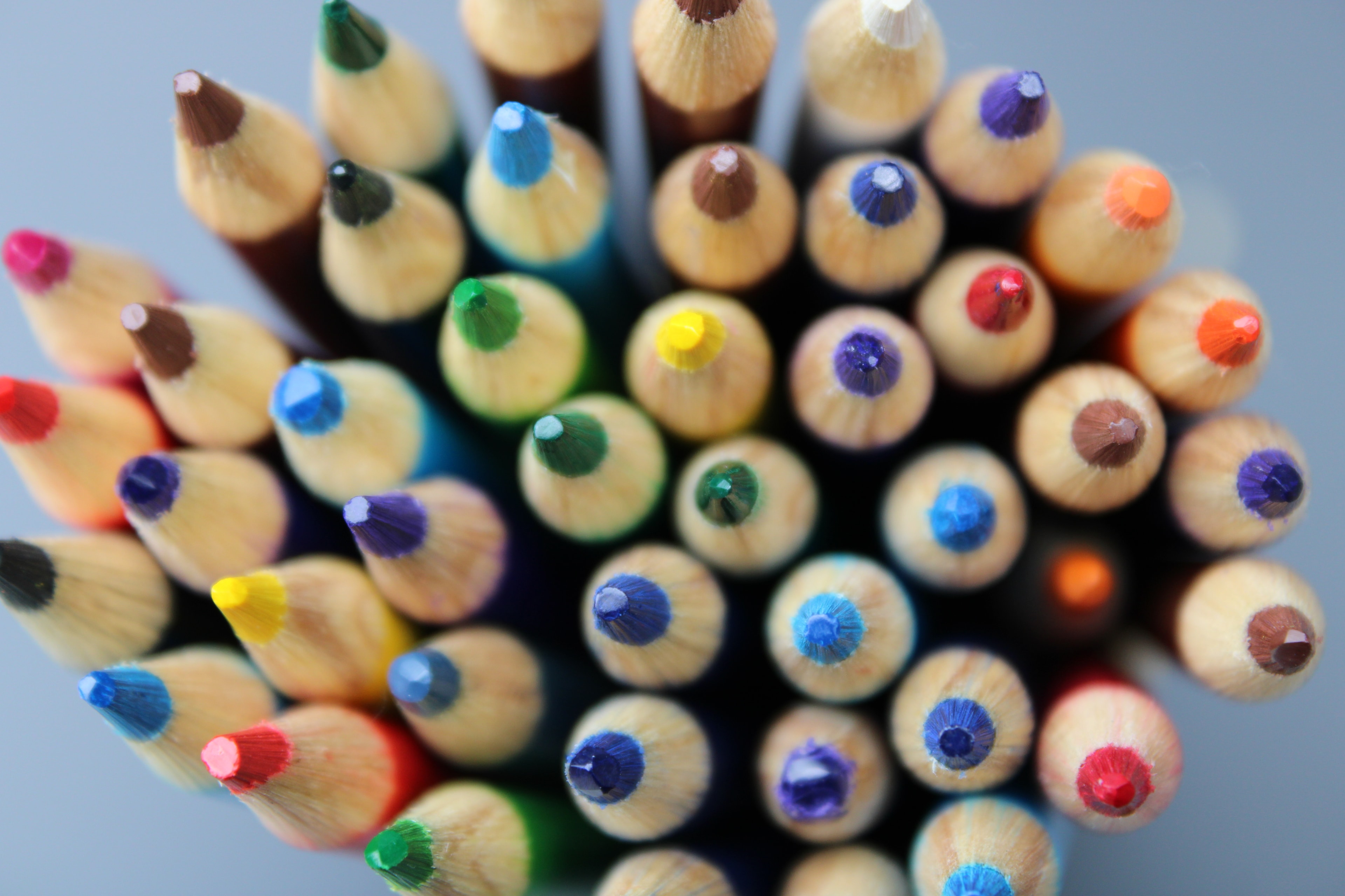 Colored pencil tips viewed from above, a mosaic of color