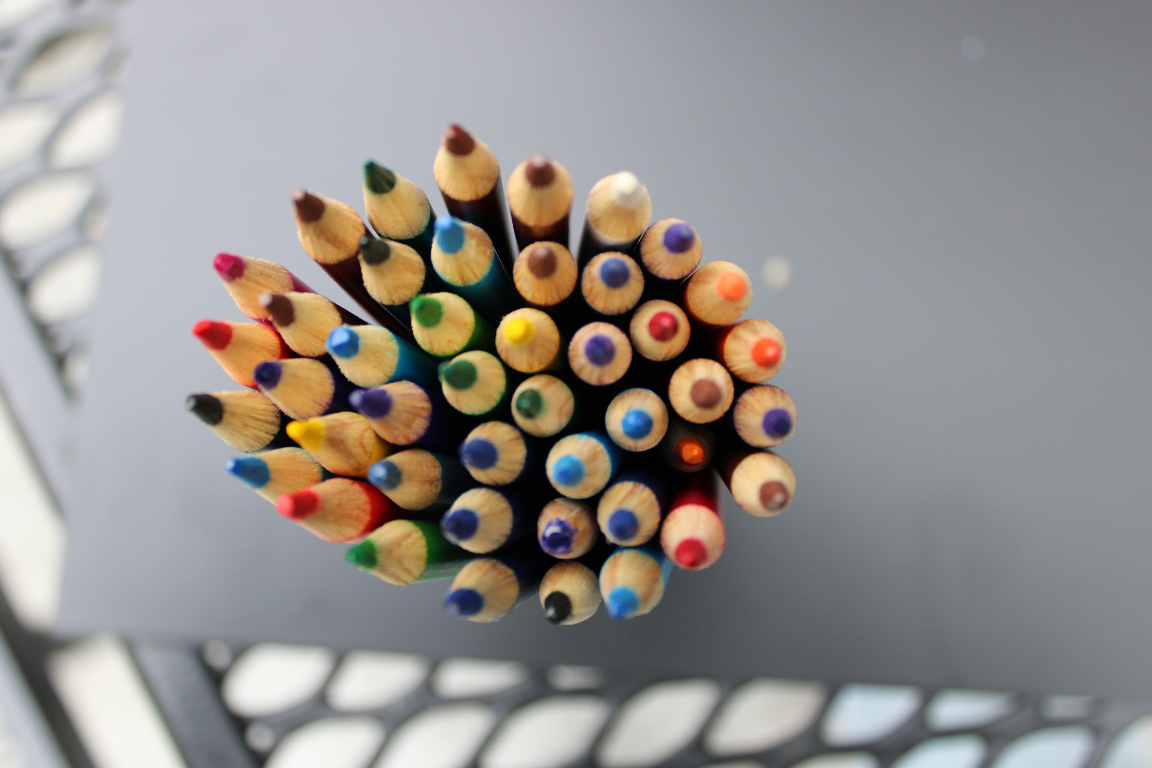 Colored pencils bundled together, tops viewed from above