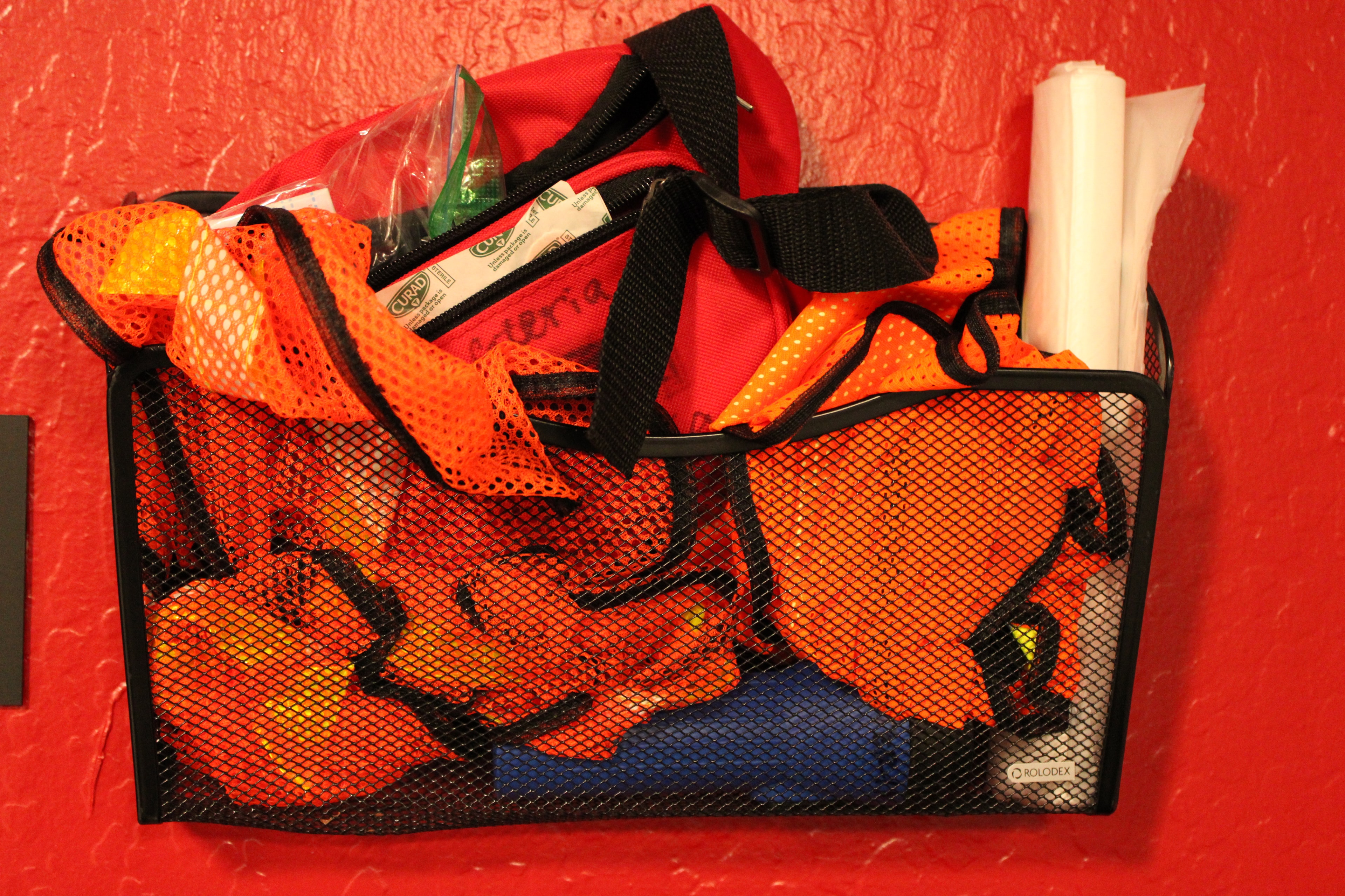 Orange sports equipment in mesh organizer