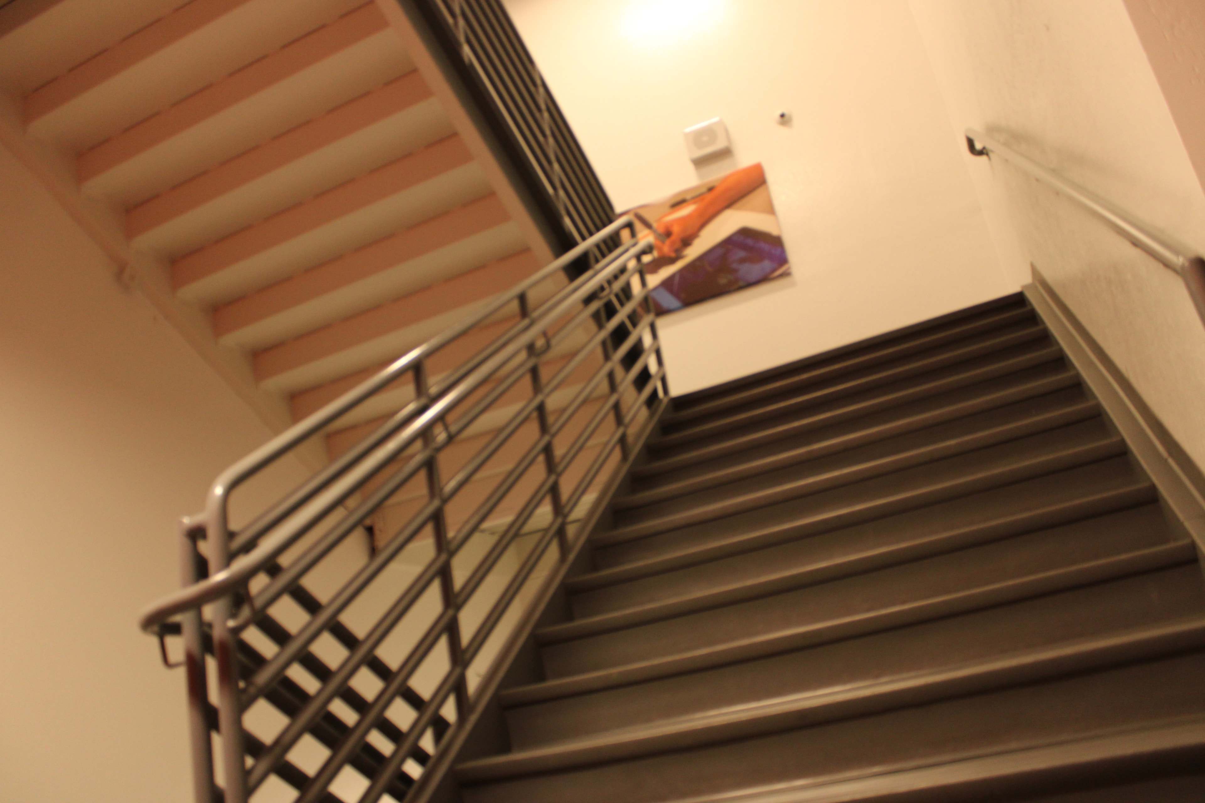 Staircase with steel railing and artwork