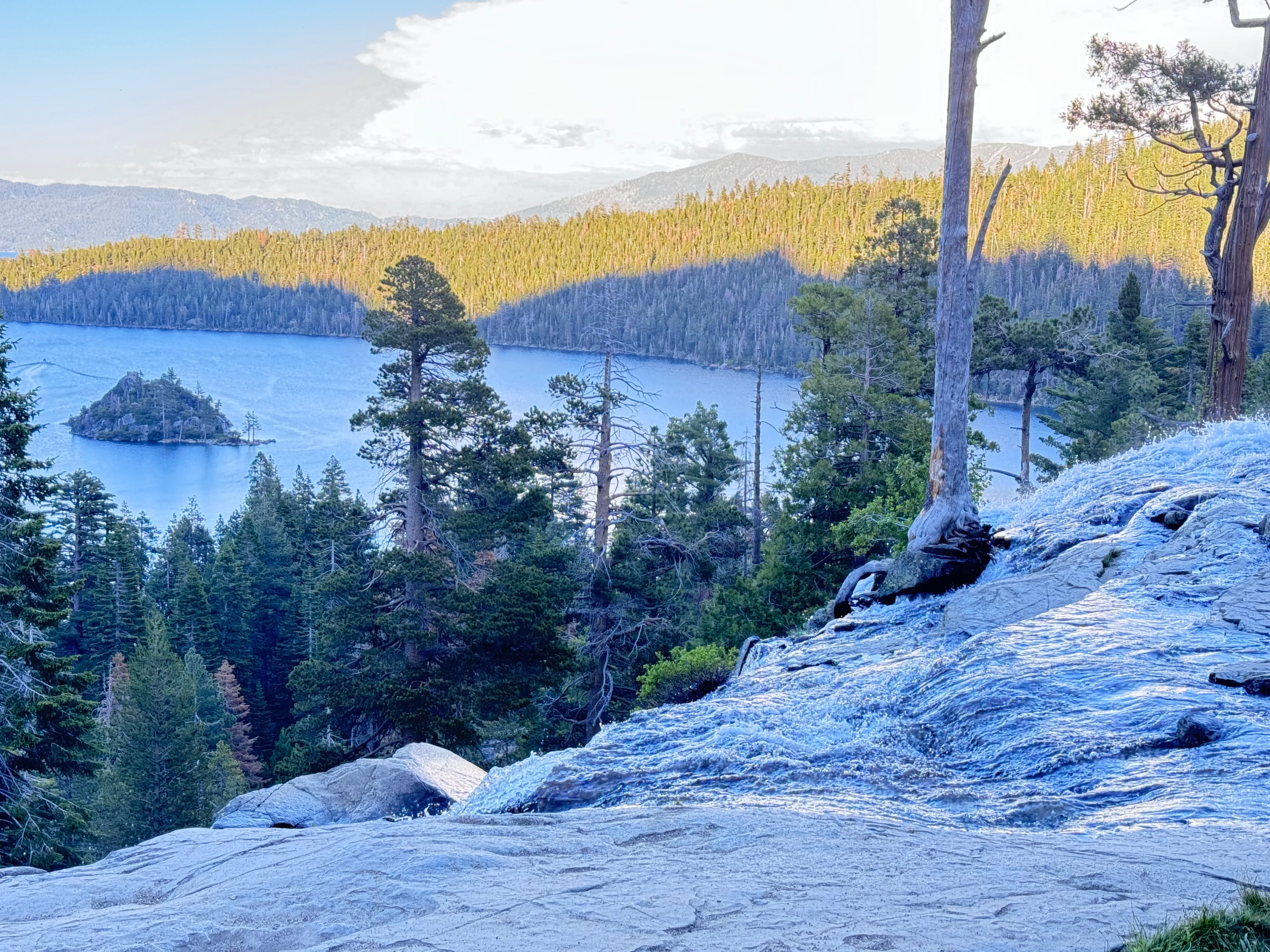 Emerald Bay at Lake Tahoe viewed from granite rocks with pine trees
